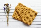 Orange handmade crochet textile suitable for a poncho project