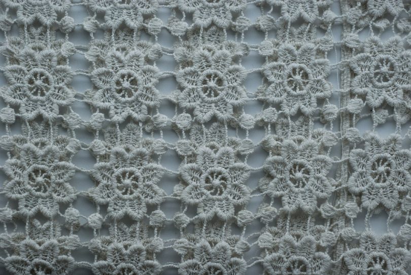 Open lace crochet mesh showing the airy filet crochet structure