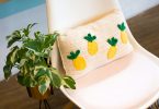 Handmade geometric crochet pillow showing tapestry-style colorwork
