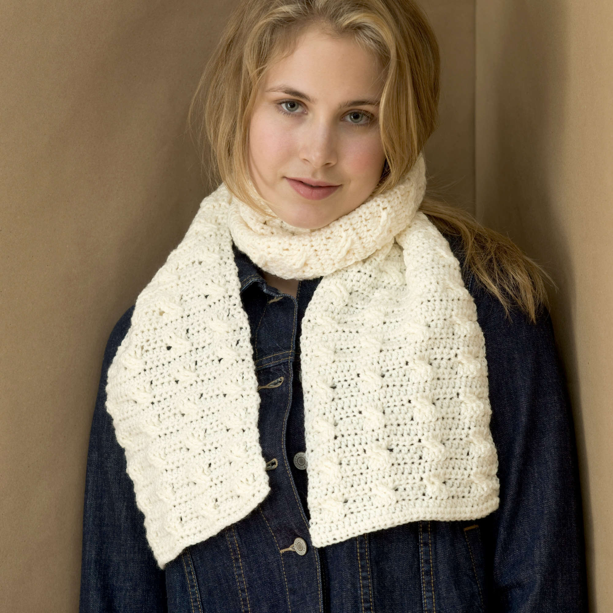 Red Heart Cable Crochet Scarf shown in the original Yarnspirations pattern photograph