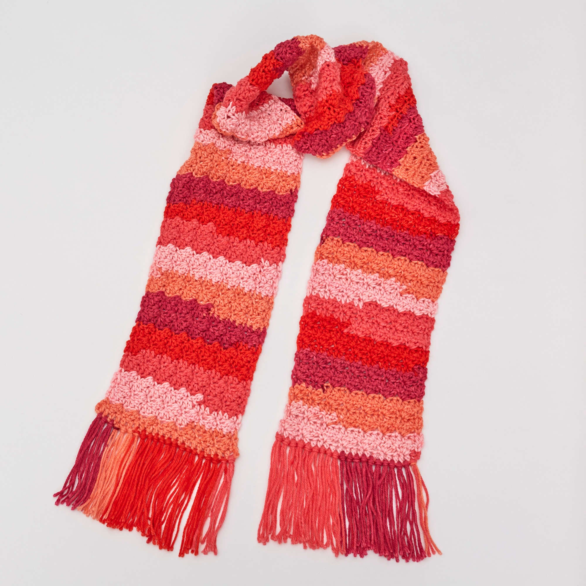 Red Heart Crochet Snazzy Striped Scarf shown in the original Yarnspirations pattern photograph