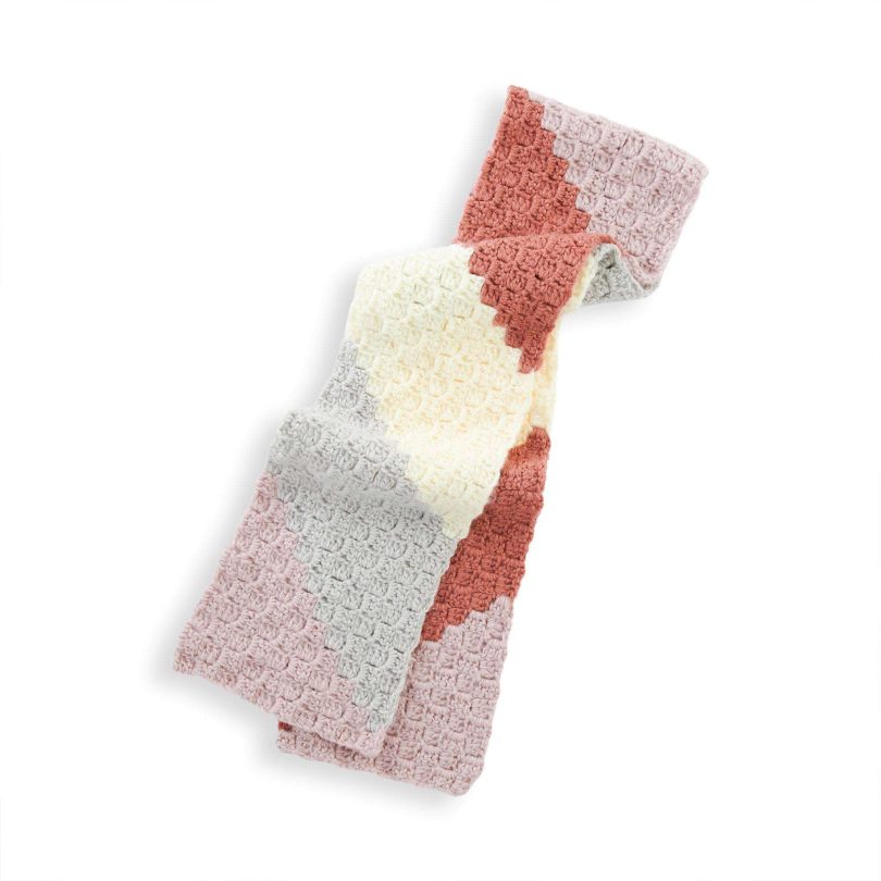Red Heart On the Bias Crochet Scarf shown in the original Yarnspirations pattern photograph