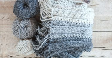 Soft yarn skeins ready for a handmade crochet scarf