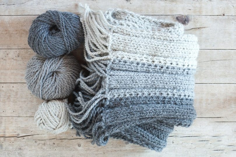 Soft yarn skeins ready for a handmade crochet scarf