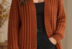 Burnt sienna crochet brioche cardigan with raised vertical stitch columns and ribbed edges